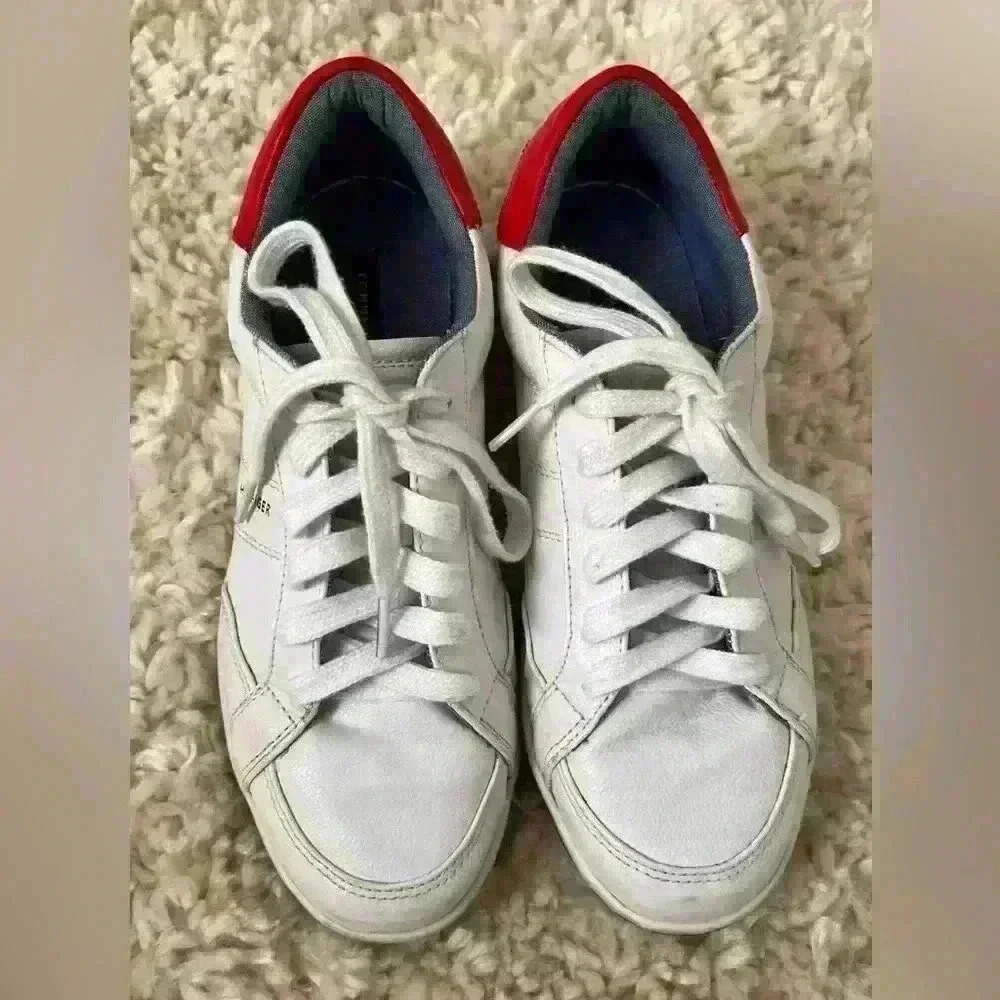 Tommy Hilfiger Women’s White with red accent sneakers.